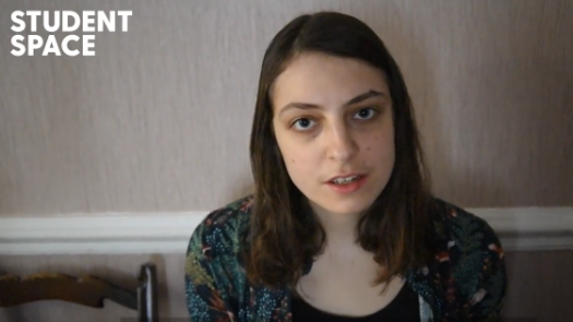 a screenshot of Beth talking to camera in a domestic setting.